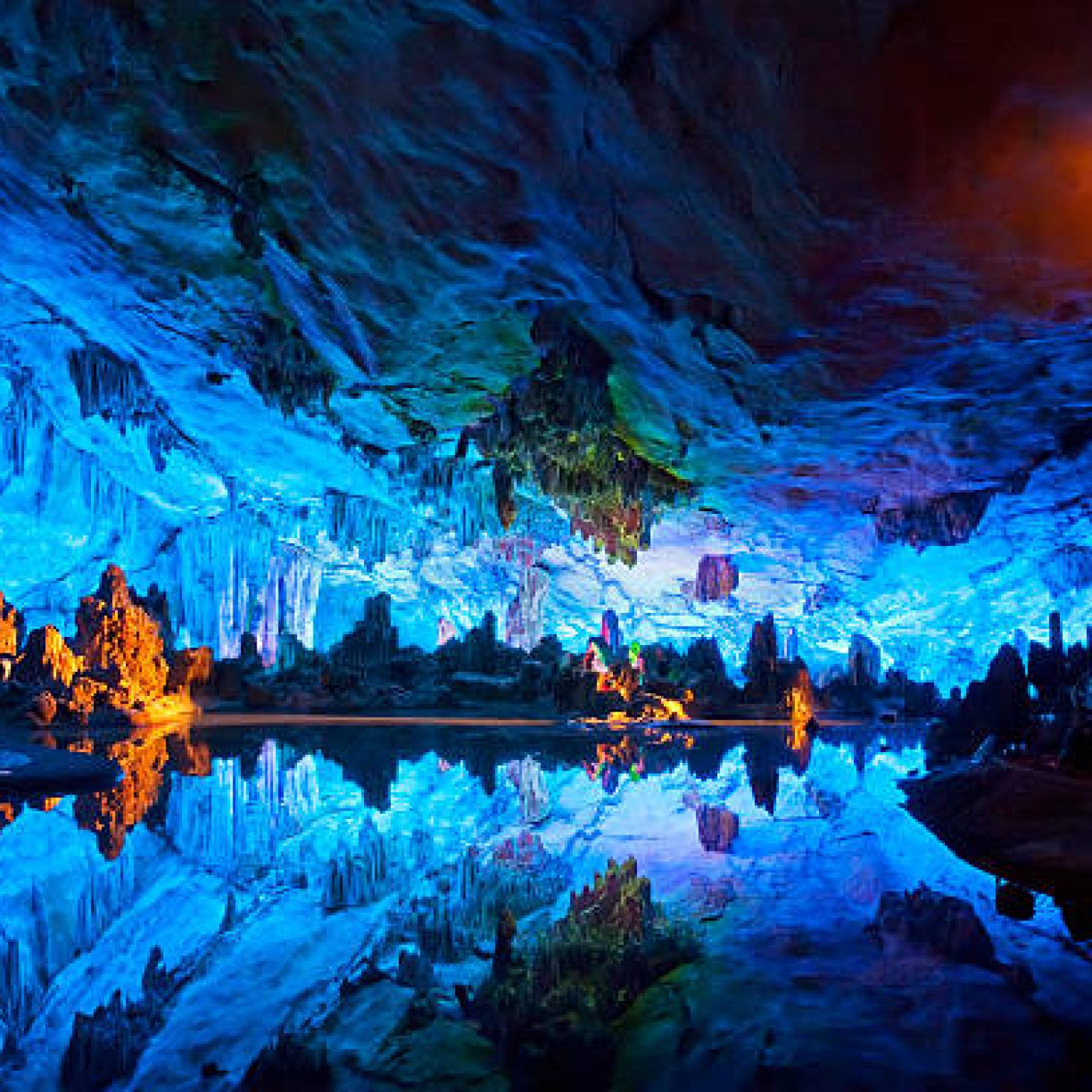 "The beautifully illuminated Reed Flute Caves displaying the ""Crystal Palace of the Dragon King"" formations. Located in Guilin, Guangxi Provine, China    "